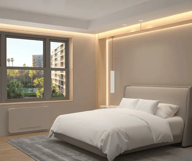 A bedroom with the console unit below the window