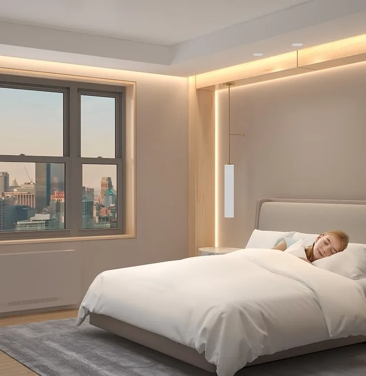 A child sleeping in a bedroom with a city view