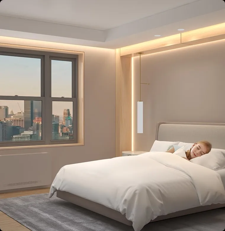 A child sleeping in a bedroom with a city view
