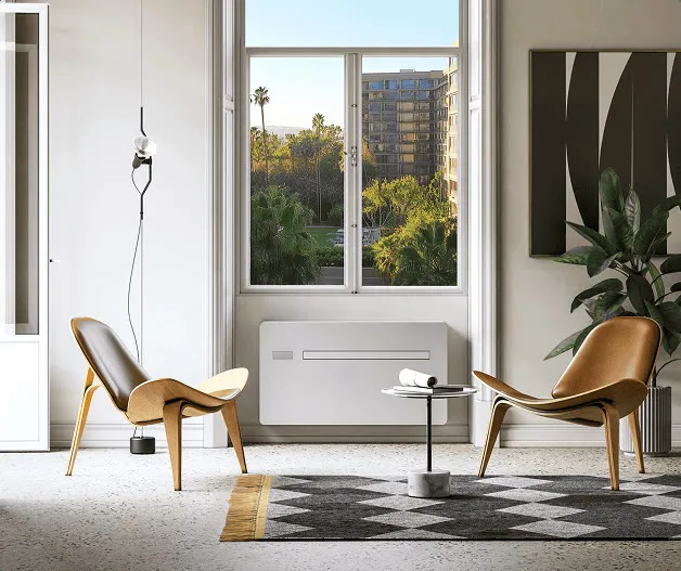A living room with the console unit under the window