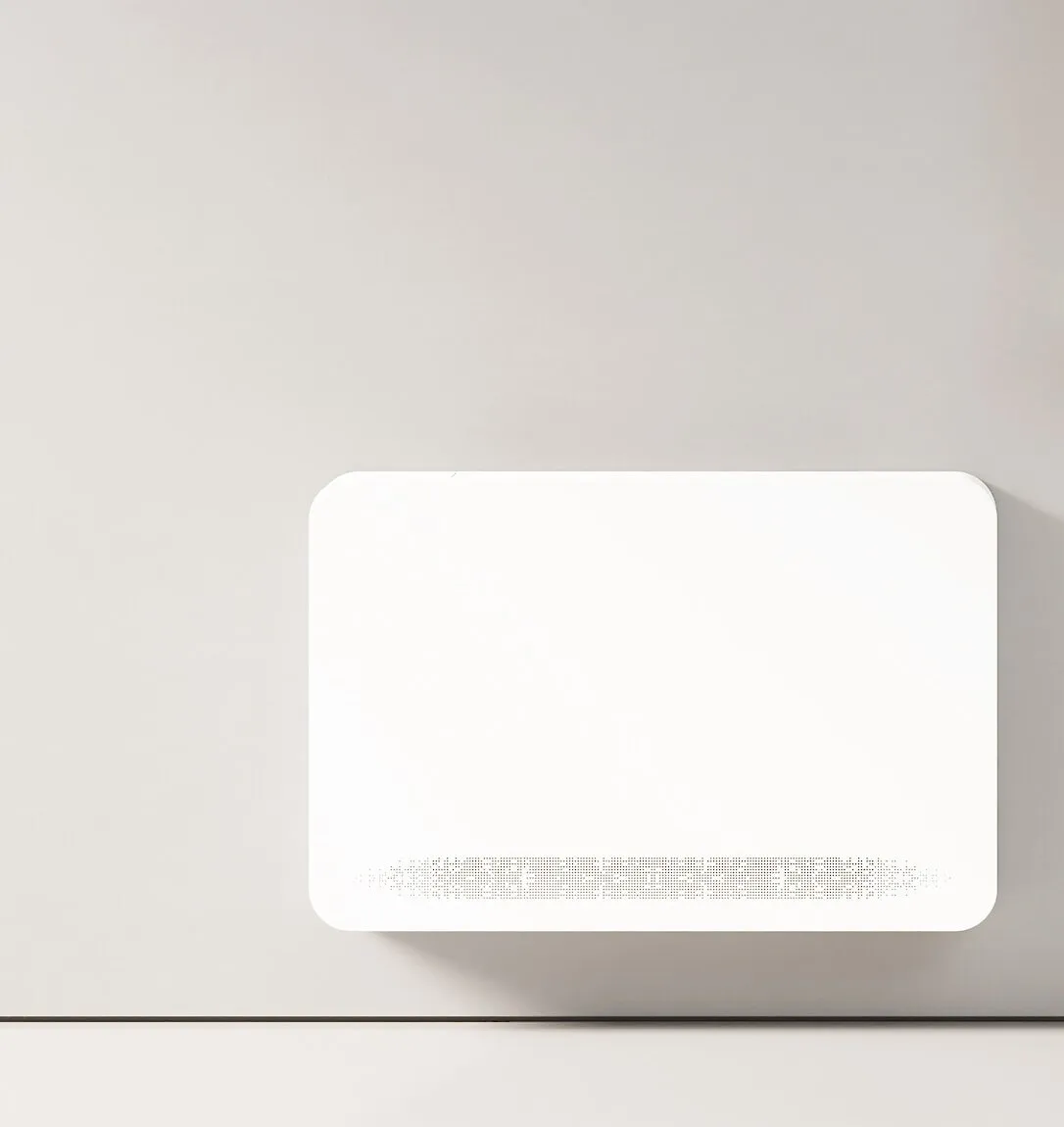 An Innova wall-mounted unit in a bright, minimally furnished interior